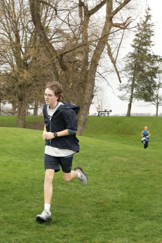 NO NEED FOR SPEED Hugh Jordan ‘26 running a half marathon in Plymouth, Michigan this past fall. “He’s always gotten something out of running,” said Christine. “He doesn’t care about his pace or time, but he will run a trail race and come back a better version of himself.”